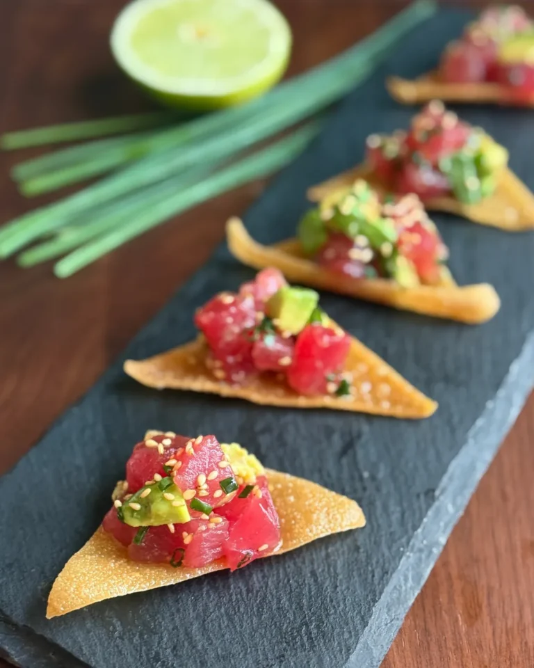 Tuna tartare served on crispy wonton chips with avocado recipe by Sweet Basil Catering NYC